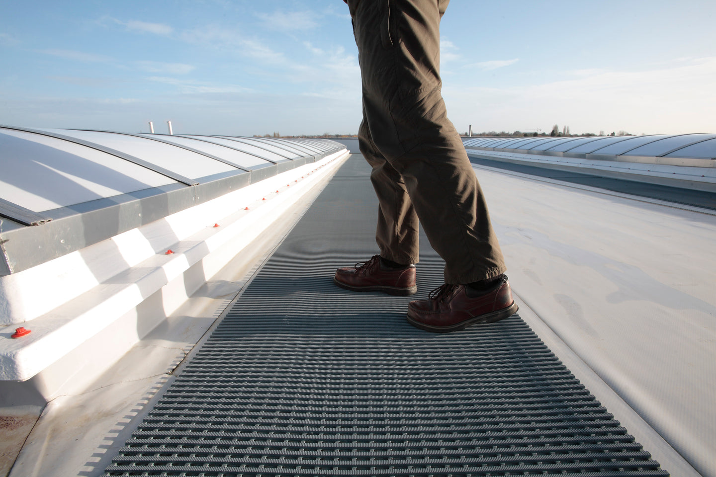 Our roof matting protects the membrane and creates safe access for workers