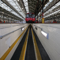 Trackgrip is wide-grid walkway matting.